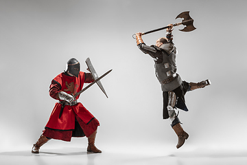 Image showing Brave armored knights fighting isolated on white studio background