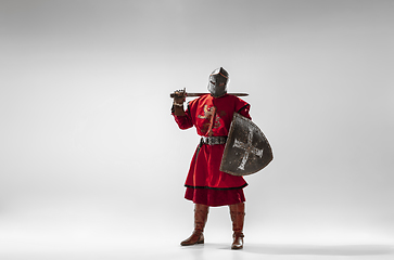 Image showing Brave armored knight fighting isolated on white studio background