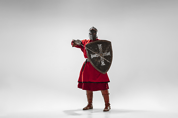 Image showing Brave armored knight fighting isolated on white studio background