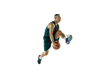 Image showing Young basketball player training isolated on white studio background