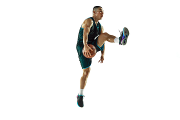 Image showing Young basketball player training isolated on white studio background