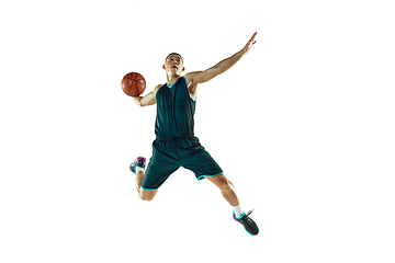 Image showing Young basketball player training isolated on white studio background