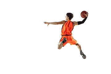 Image showing Young basketball player training isolated on white studio background