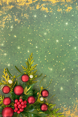 Image showing Christmas Background with Winter Greenery and Red Baubles