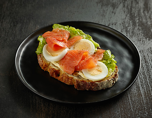 Image showing slice of bread with egg and salmon