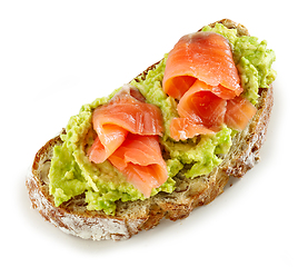 Image showing slice of bread with avocado and salmon