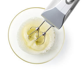 Image showing beating egg whites cream with mixer in the bowl