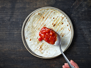 Image showing process of making tacos