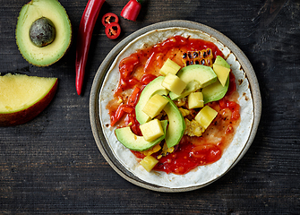 Image showing process of making tacos