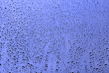 Image showing Water drops on glass, blue natural background