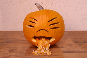 Image showing Halloween funny pumpkin on wooden table 