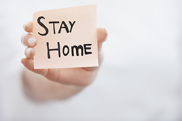 Image showing Hand holding sticky note with Stay Home text