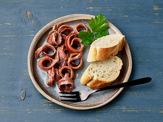 Image showing plate of canned anchovy fillets