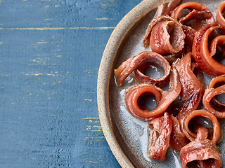 Image showing plate of canned anchovy fillets