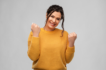 Image showing happy young woman celebrating success