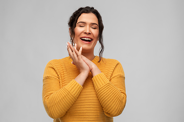 Image showing happy smiling young woman with pierced nose