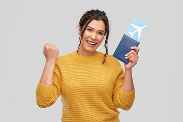 Image showing happy young woman with air ticket and passport