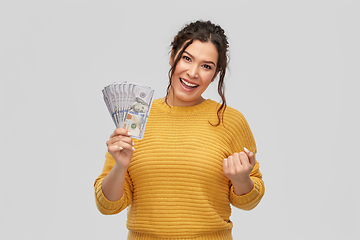 Image showing happy smiling young woman with dollar money