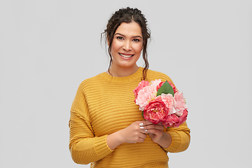 Image showing happy smiling young woman with bunch of flowers