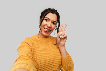 Image showing woman with pierced nose taking selfie shows peace