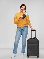 Image showing woman with passport, air ticket and travel bag