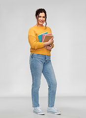 Image showing smiling young student woman with pierced nose