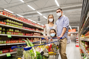 Image showing family with shopping cart in masks at supermarket