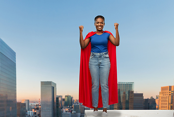 Image showing happy african american woman in red superhero cape