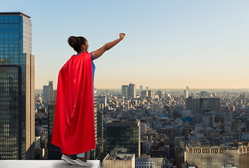 Image showing happy african american woman in red superhero cape