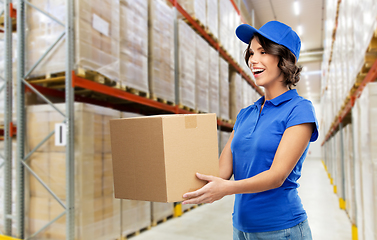 Image showing happy delivery girl with parcel box at warehouse