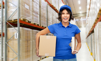 Image showing happy delivery girl with parcel box at warehouse