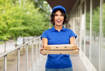 Image showing delivery woman with takeaway pizza boxes