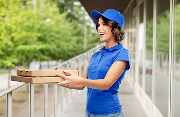 Image showing delivery woman with takeaway pizza boxes