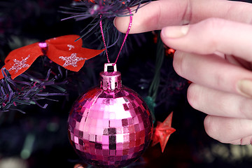 Image showing Christmas ornaments on tree.