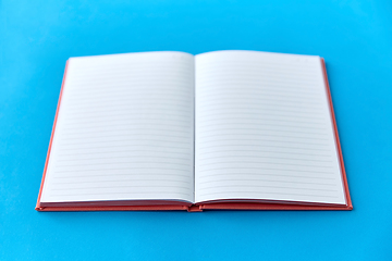 Image showing open notebook or diary on blue background