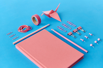 Image showing pink notebook, pins, clips, pencils and rubbers