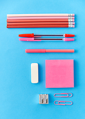 Image showing pink sticky notes, pens, pencils, clips and eraser