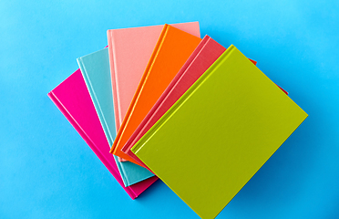 Image showing notebooks or books on blue background