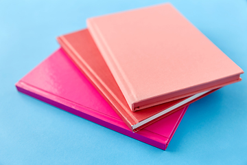 Image showing notebooks or books on blue background