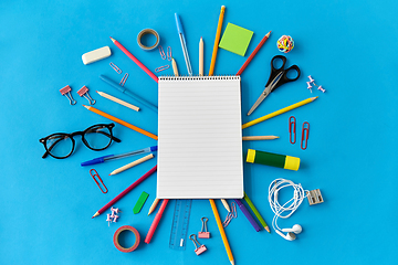 Image showing notebook and school supplies on blue background