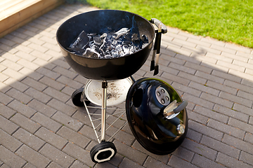 Image showing charcoal smoldering in brazier outdoors