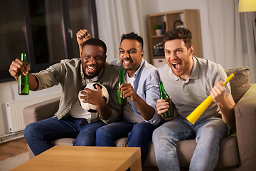 Image showing friends or soccer fans with ball and beer at home