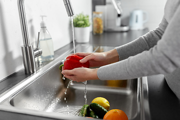 Image showing woman washing fruits and vegetables in kitchen