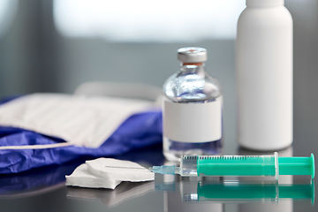 Image showing syringe, medicine, wound wipes, gloves and mask