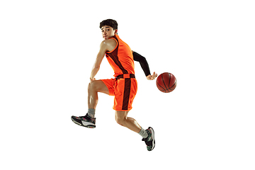 Image showing Young basketball player training isolated on white studio background