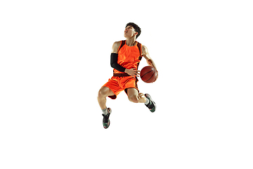 Image showing Young basketball player training isolated on white studio background