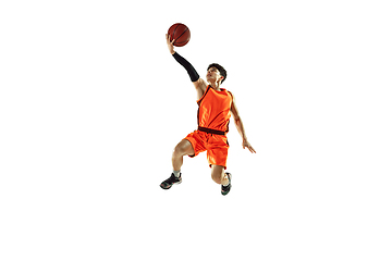 Image showing Young basketball player training isolated on white studio background