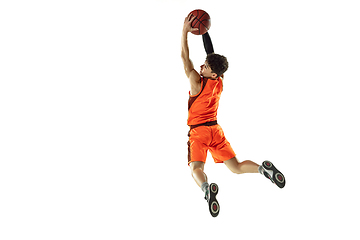 Image showing Young basketball player training isolated on white studio background