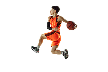 Image showing Young basketball player training isolated on white studio background