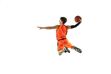 Image showing Young basketball player training isolated on white studio background